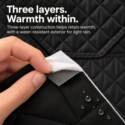 Hand separating the three layers of Willowybe sauna tent fabric, showing the black outer material, inner insulation and water droplets